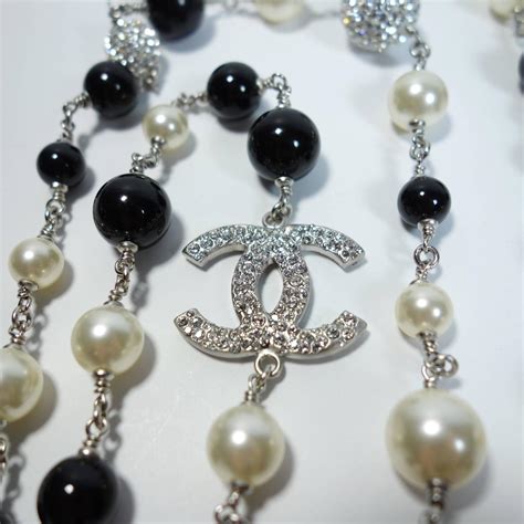 chanel black and white flower necklace|long Chanel necklace with pearls.